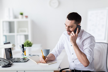 Image showing businessman calling on smartphone at office