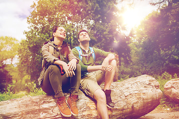 Image showing smiling couple with backpacks in nature