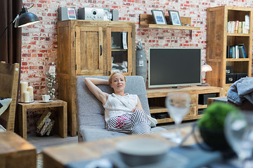 Image showing Woman shopping for furniture, sofa and home decor in store