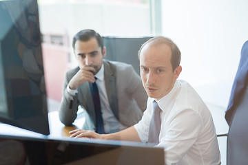 Image showing Business team analyzing data at business meeting.