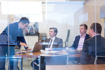 Image showing Business people sitting and brainstorming at corporate meeting.