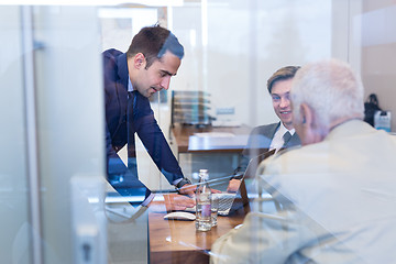 Image showing Business people sitting and brainstorming at corporate meeting.