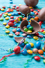 Image showing Candy, chocolate eggs, colored ribbons