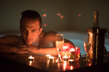 Image showing man relaxing in the jacuzzi