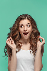 Image showing The young woman\'s portrait with happy emotions