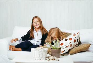 Image showing two cute sisters at home playing, little girl in house interior 