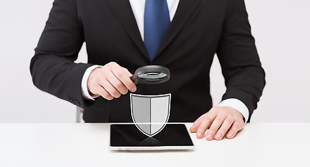 Image showing businessman with tablet pc antivirus program icon