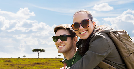 Image showing happy couple with backpacks traveling in africa