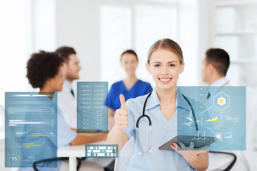 Image showing doctor with tablet pc at clinic showing thumbs up