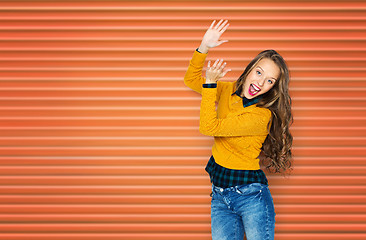 Image showing happy young woman or teen girl applauding