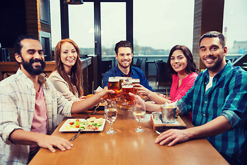 Image showing friends dining and drinking beer at restaurant