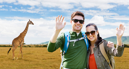 Image showing smiling couple with backpacks traveling in africa