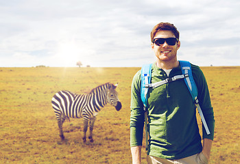 Image showing happy young man with backpack traveling in africa