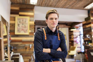 Image showing male hairdresser at hair salon or barbershop