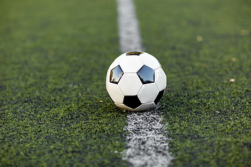 Image showing soccer ball on football field marking line