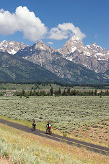 Image showing Cyclist Ride Bicycles Down a Path Grand Tetons