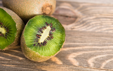 Image showing Whole Food Fruit Green Kiwi Halves Seeds Cutting Board