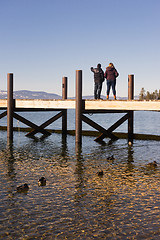 Image showing Two people sight see off dock Lake Tahoe