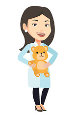 Image showing Pediatrician doctor holding teddy bear.