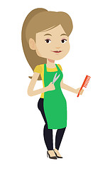 Image showing Hairstylist holding comb and scissors in hands.