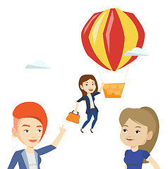 Image showing Business woman hanging on balloon.