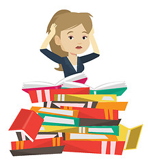 Image showing Student sitting in huge pile of books.