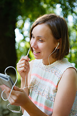 Image showing Laughing woman talking phone