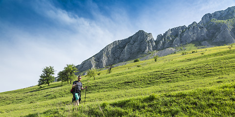 Image showing Man Hiking in Green Mountains