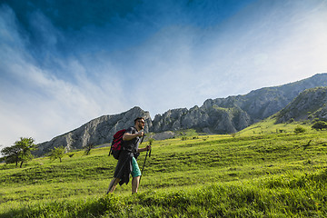 Image showing Man Hiking in Green Mountains