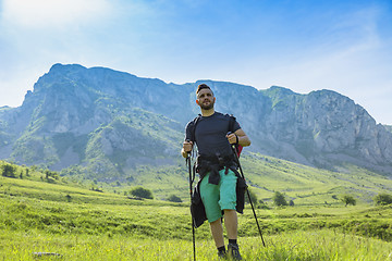 Image showing Man Hiking in Green Mountains