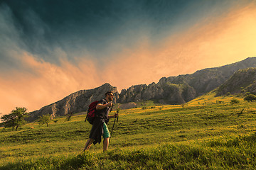 Image showing Man Hiking in Green Mountains