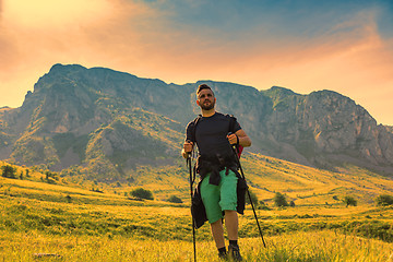 Image showing Man Hiking in Green Mountains