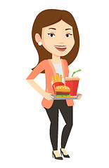 Image showing Woman holding tray full of fast food.