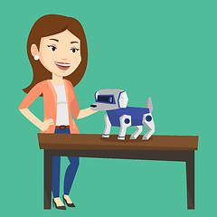 Image showing Happy young woman playing with robotic dog.