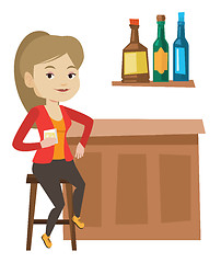 Image showing Woman sitting at the bar counter.