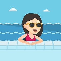 Image showing Smiling young woman in swimming pool.