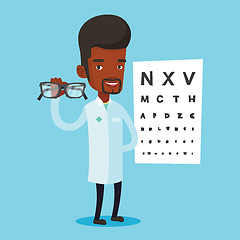 Image showing Professional ophthalmologist holding eyeglasses.