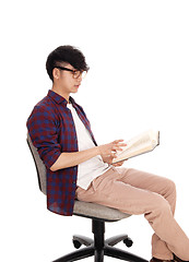 Image showing Asian teenager reading book.