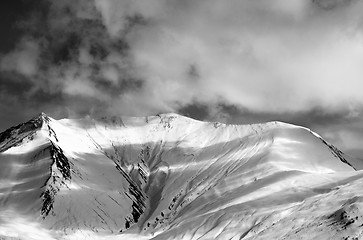 Image showing Black and white view on off-piste snow slope in evening