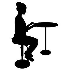 Image showing Silhouette girl sitting on a chair white background