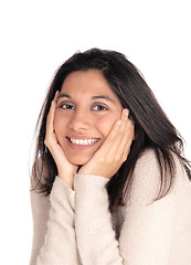 Image showing Happy woman holding her face in her hands.