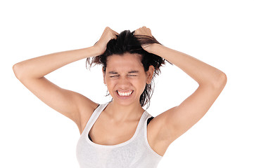 Image showing Angry woman messing her hair.