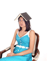 Image showing Woman balancing book on head.