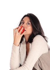 Image showing Woman eating red apple.