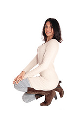 Image showing Happy Hispanic woman kneeling.