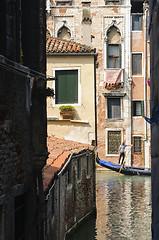 Image showing Ancient buildings and a gondola on the canal in Venice, Veneto, 