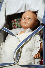 Image showing old vintage doll in a stroller