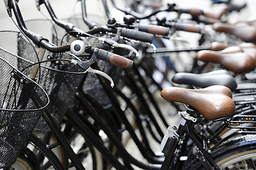 Image showing row of bicycles on the street 