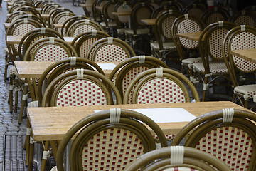 Image showing empty coffee tables in the rain