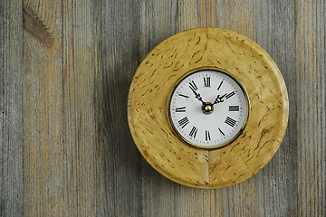Image showing round clock from Karelian birch